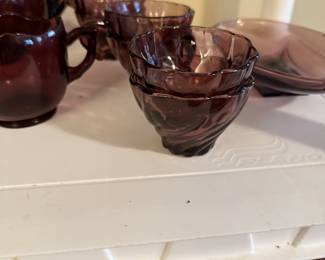 Amethyst dishes with serving pieces and tall vase