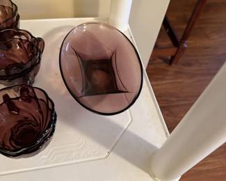 Amethyst dishes with serving pieces and tall vase