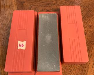 #116	2 sharping stones in plastic case 	 $20.00 
