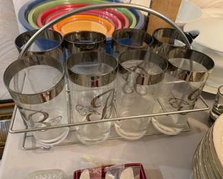 #102	8 silver rim glasses in a caddy with B on them 	 $20.00 
