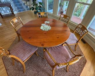 Baker dining pine table  with 2 leaves and 6 cane bottom chairs
