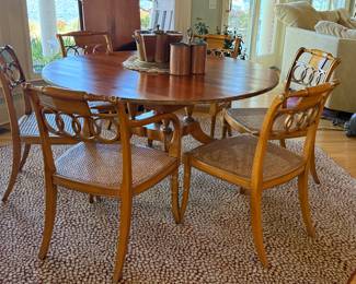 Baker Historic Collection dining table (with 2 leaves and pads) and 6 cane bottom chairs.  