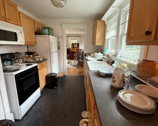 You can access the Kitchen by going straight through the living room.