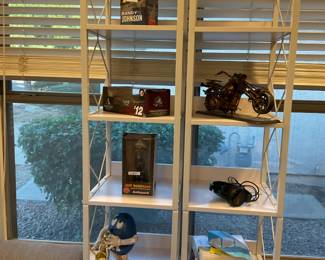 2- seven shelf metal units in white72 “ tall there are separate sale items on the shelf including a Jeff Dunham’s Achmed bobblehead, a Randy Johnson bobble head, headphones