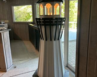 Over six feet tall, the plug in light works & turns!