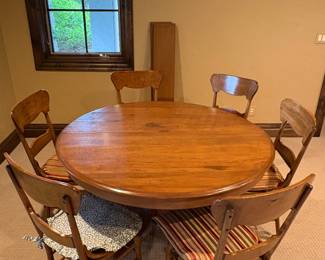 Wood Round to oval split pedestal dining table.
Set of six wood dining chairs