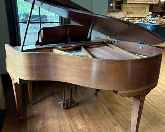 Howard walnut baby grand piano