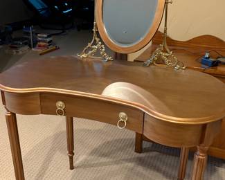 Gold toned kidney shaped vanity w/ mirror