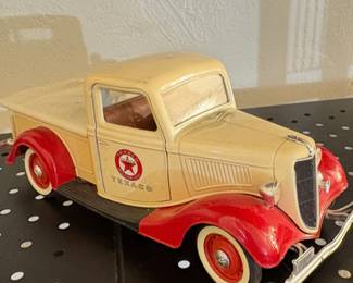 Diecast model of a 1936 Ford V8 pickup truck, featuring the Texaco logo and paint scheme.
