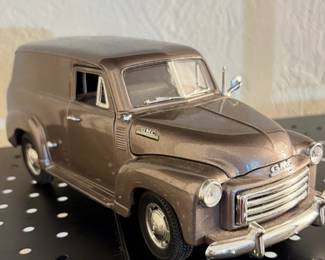 Diecast model of a 1950 GMC Panel Truck, Mira Golden Line series.