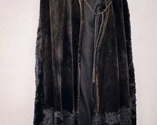 black velvet hooded cape with faux fur trim.