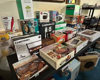 Tables filled with small  appliances. New in box. 