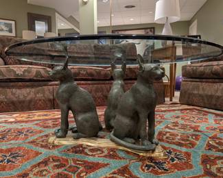 Glass top "bronze" cats cocktail table