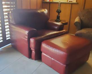 Red leather accent chair with ottomon