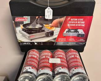 R32 - $20. Brand New Coleman Butane Stove with a 4 pack of Butane. 