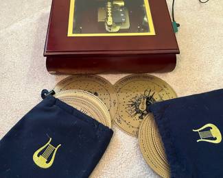 R63 - $55. Mr. Christmas Music Box with 32 "Records".  Includes power cord & works!