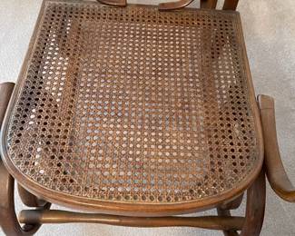 R19 - $50. Vintage Single Caned Rocking Chair. Measures 19.5" x 17" x 40.25" tall. 