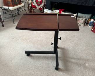 R76 - $20. Adjustable & Portable Laptop Table. Measures 31.25" x 18" deep and height adjusts. 