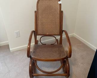 R19 - $50. Vintage Single Caned Rocking Chair. Measures 19.5" x 17" x 40.25" tall. 