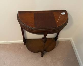 R16 - $30. Antique Demilune Table. Measures 23.5" x 12" deep x 28.75" tall. In good antique condition. 