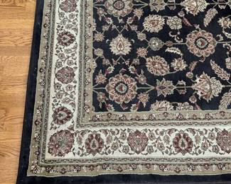 R30 - $40. Living Room Area Rug. Measures 6'6" x 9'3". (No tag - polyester material)