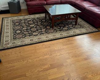 R30 - $40. Living Room Area Rug. Measures 6'6" x 9'3". (No tag - polyester material)