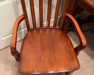 R3 - $25. Single Wooden Arm Chair. Measures 22.75" wide x 17.75" deep x 39.25" tall. Has rubbing from seat cushion on one back spindle. 