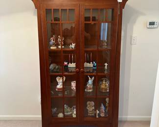 R1 - $650. Ethan Allen Mission Style Display Cabinet. Measures 43" wide x 15" deep x 70" tall. 3 Glass Shelves are adjustable. There is one leg that has very minor damage (see last photo)
