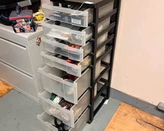 R33 - $25. Plastic Organizer with contents (small tools, household items, picture hanging accessories, extension cords etc). 