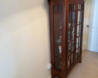 R1 - $650. Ethan Allen Mission Style Display Cabinet. Measures 43" wide x 15" deep x 70" tall. 3 Glass Shelves are adjustable. There is one leg that has very minor damage (see last photo)