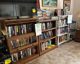 Hardcover books and paperback six bookshelves full of books