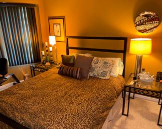 Entire vintage bedroom set for sale. Black wrought iron bed frame and matching nightstands. Leopard print comforter and decorative pillows for sale,