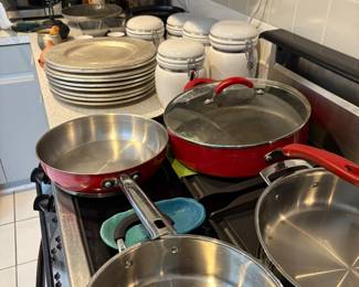 Pots and pans, kitchen ware, olive oil and microwave for sale.