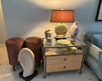 Rattan accent pieces. Table lamps, floral vases, candles. decorative plates and Navajo inspired decor. Floor art, women's bust.