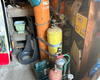 a welders dream! Welding masks and several welding tanks!