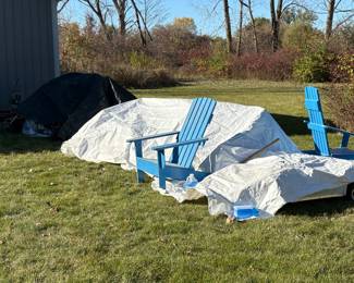 Blue wooden adirondack chairs.