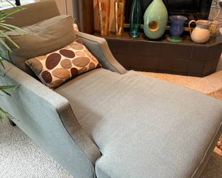 Mint green upholstered chaise lounge chair.