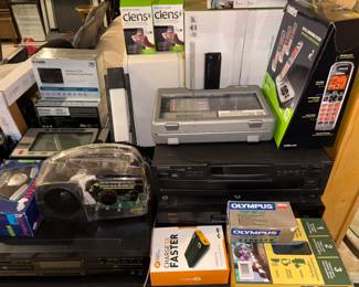 Uniden wireless phone set. Lens cleaners . Portable chargers and more! All new, never used!