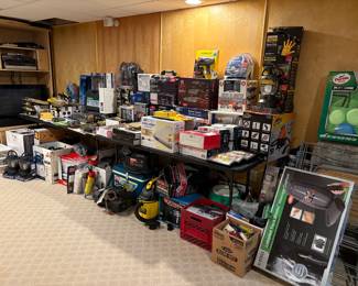 New in box shop vac. New in box Homedics massage cushion. New in box Turtle car cleaning kit. New in box grease gloves.