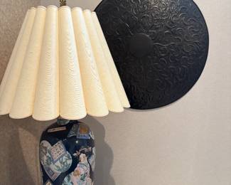 Oriental Lamp with characters on base. Blue, pink and ivory hues. Lamp shade is ivory.