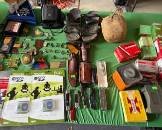 Brand new Toshiba 8 GB memory cards. Knives, Swarovski Crystal ornaments (in decorative boxes), Bushnell range finder and lots of firearm ammunition