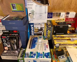 New in box cuisinaet coffee bean grinder. Pancake griddle.  Shaving kits, noise canceling headphones. New in box Conair instant hot lather shaving kit.