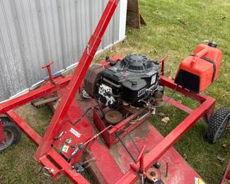tractor pull behind lawn mower, gas powered.