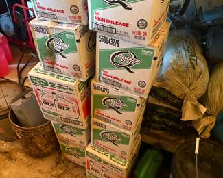 Multiple unopened boxes of quaker state motor oil.