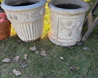 Outdoor planters with floral design.