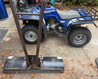 Snowplow attachment and Honda 4-wheeler.