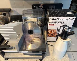 New in box Elite Gourmet Percolator. Meat slicer, Vinturi wine aerator, and more kitchen ware.