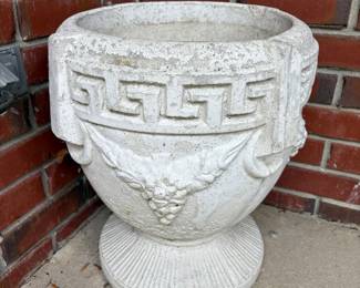 Outdoor stone planter with Greek Key.