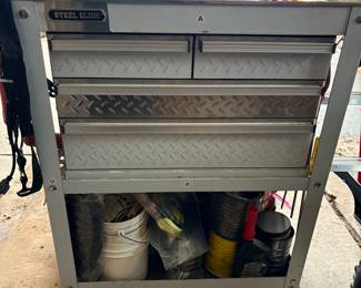 Full size Steel Glide tool chest on wheels with drawers and a lower shelf.