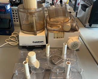 Vintage Cuisinart food processor with pasta maker attachment and various blades